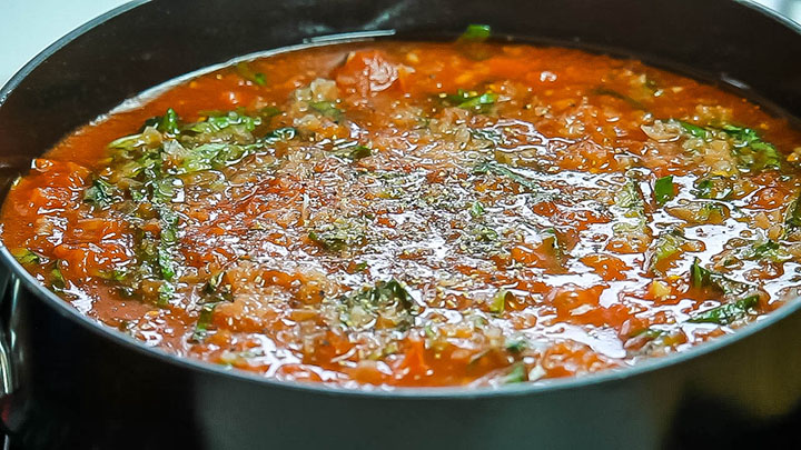 salt and pepper added to the Simple Marinara Sauce in the pan