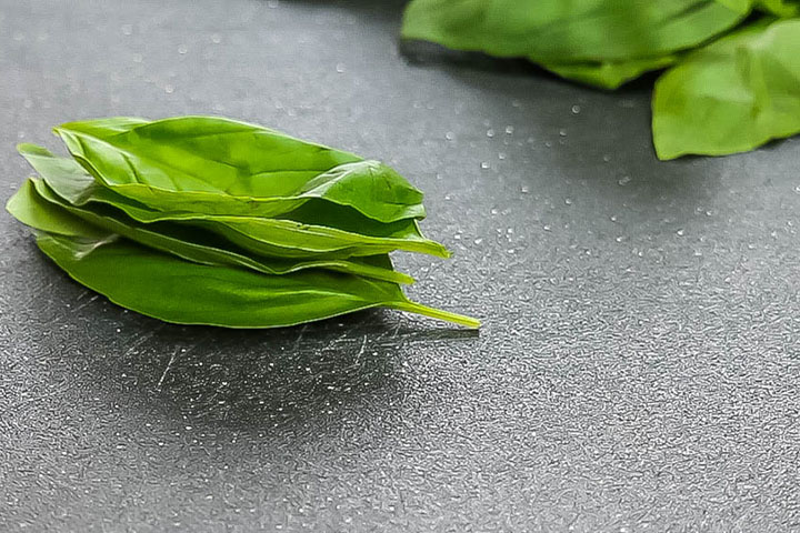 basil leaves stacked on top of each other.