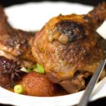 duck with plums on a plate ready to serve