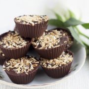 a pile of homemade coconut mounds cups