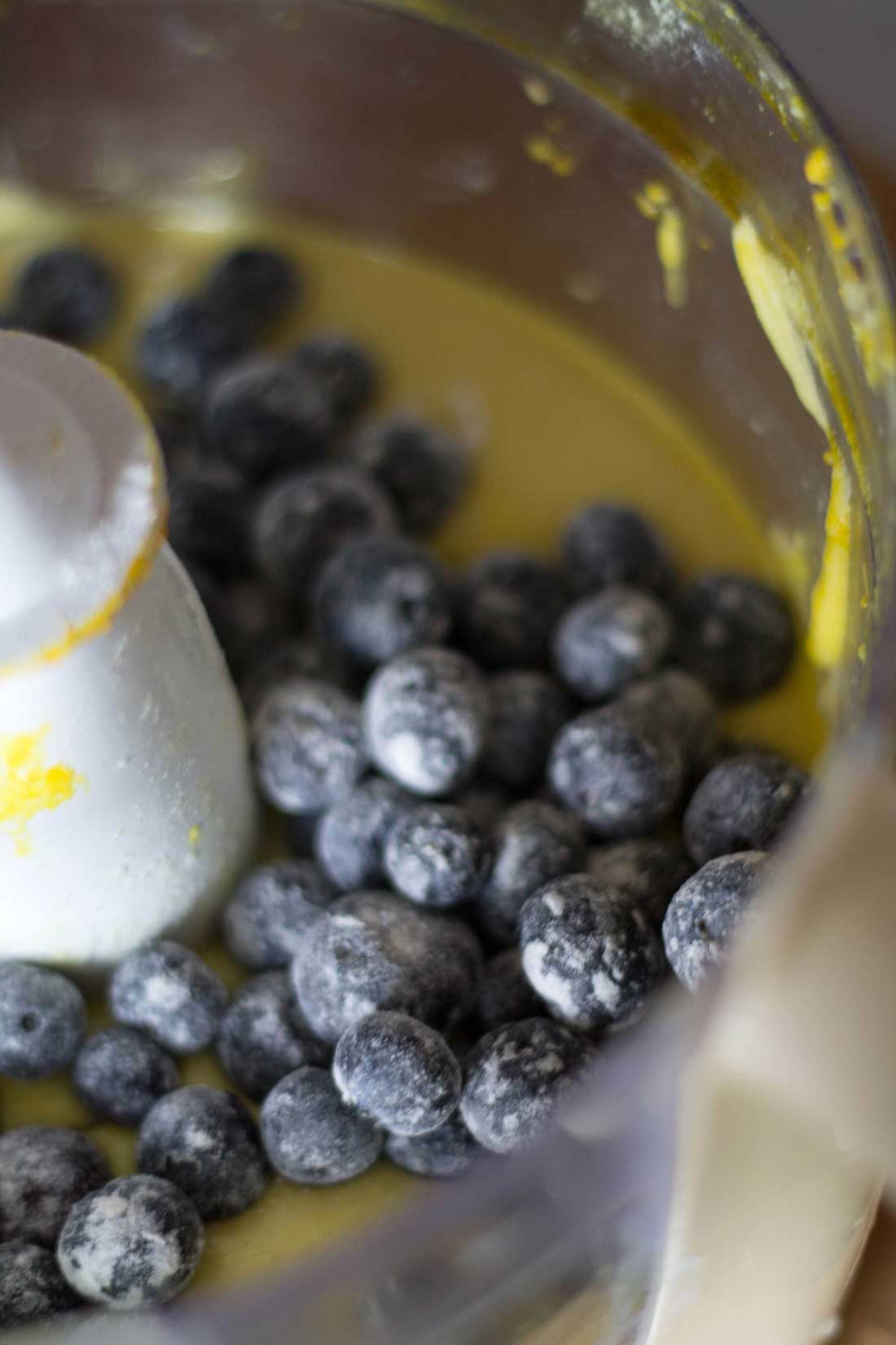 The cake batter in the food processor with a the blueberries added.
