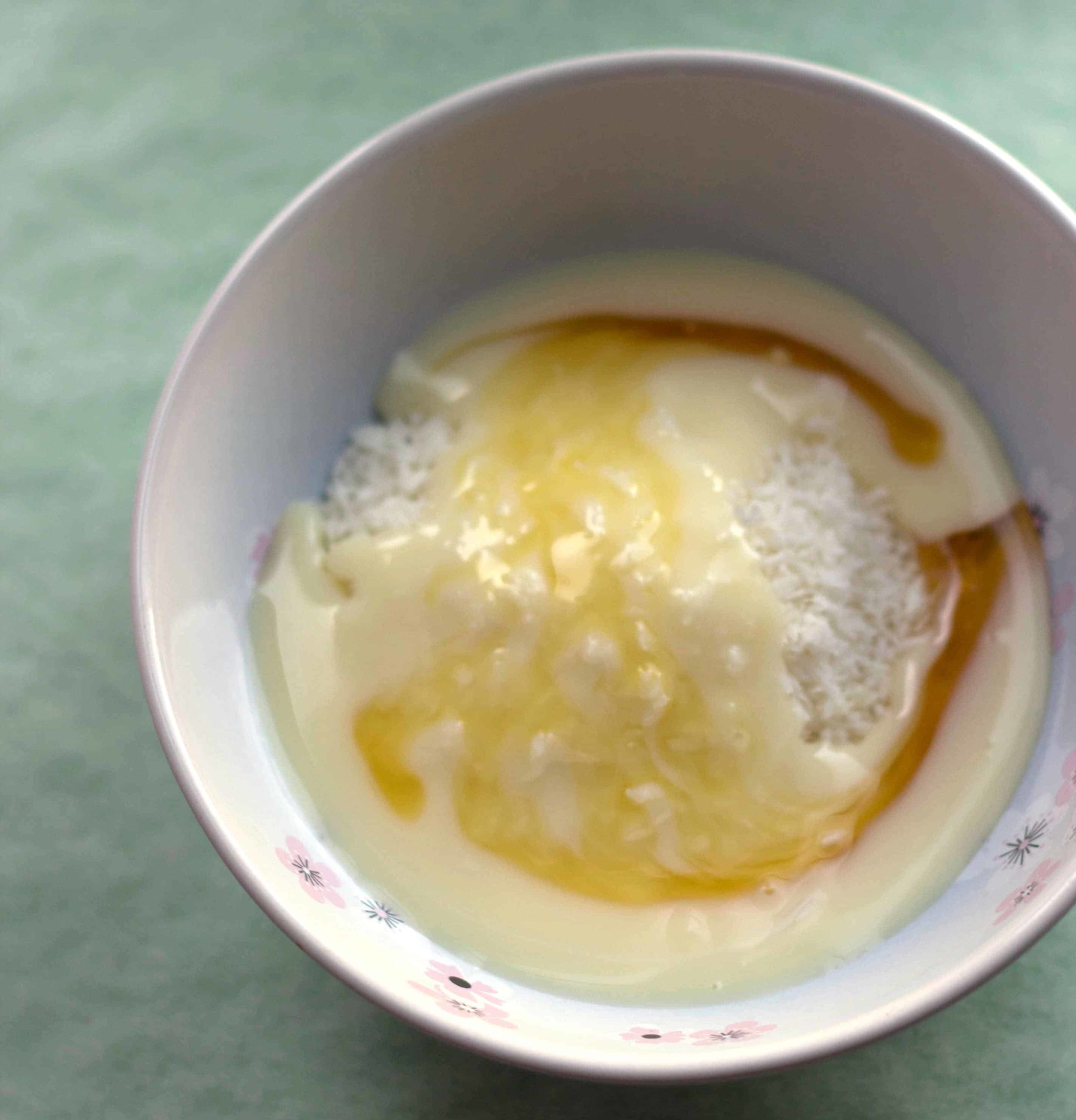 golden syrup, shredded coconut mixed in a bowl