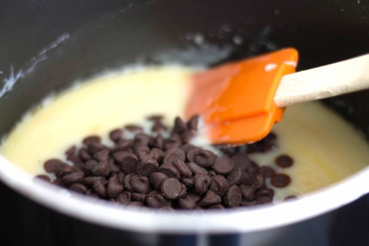 Chocolate chips added to the mixture in the pan