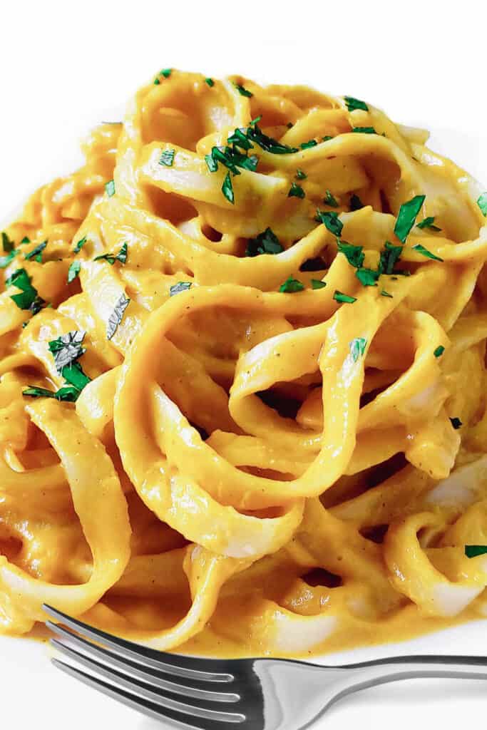 a plate piled high with Tagliarini in Saffron Cream Sauce