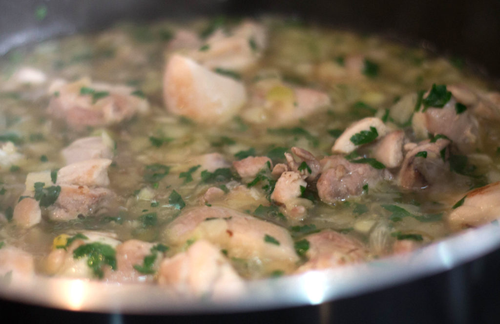 stock added to the pan of chicken