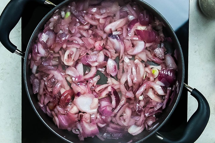 red onion cooking in pan