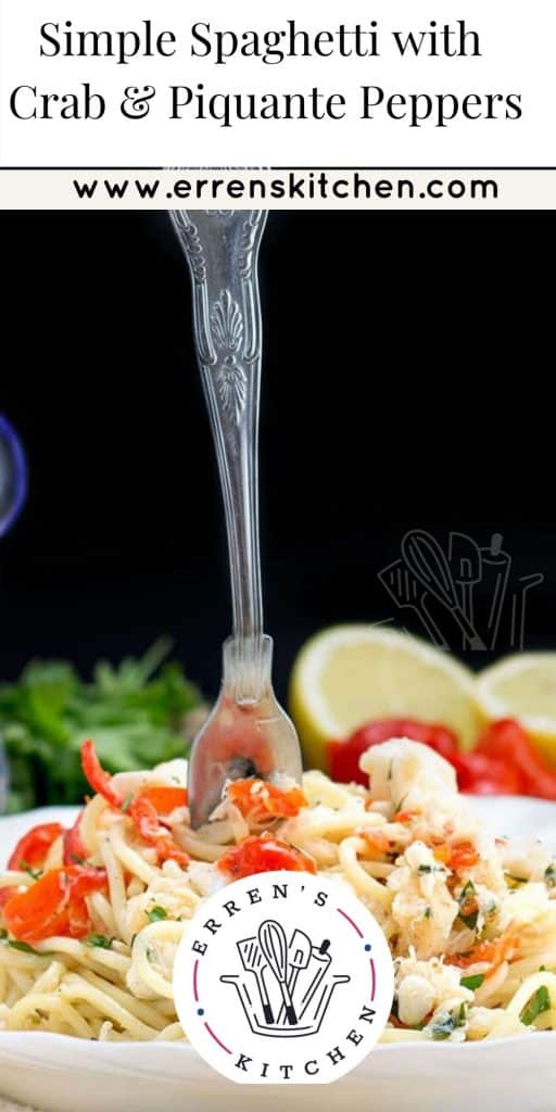 a plate of pasta with crab and a fork sticking out of it