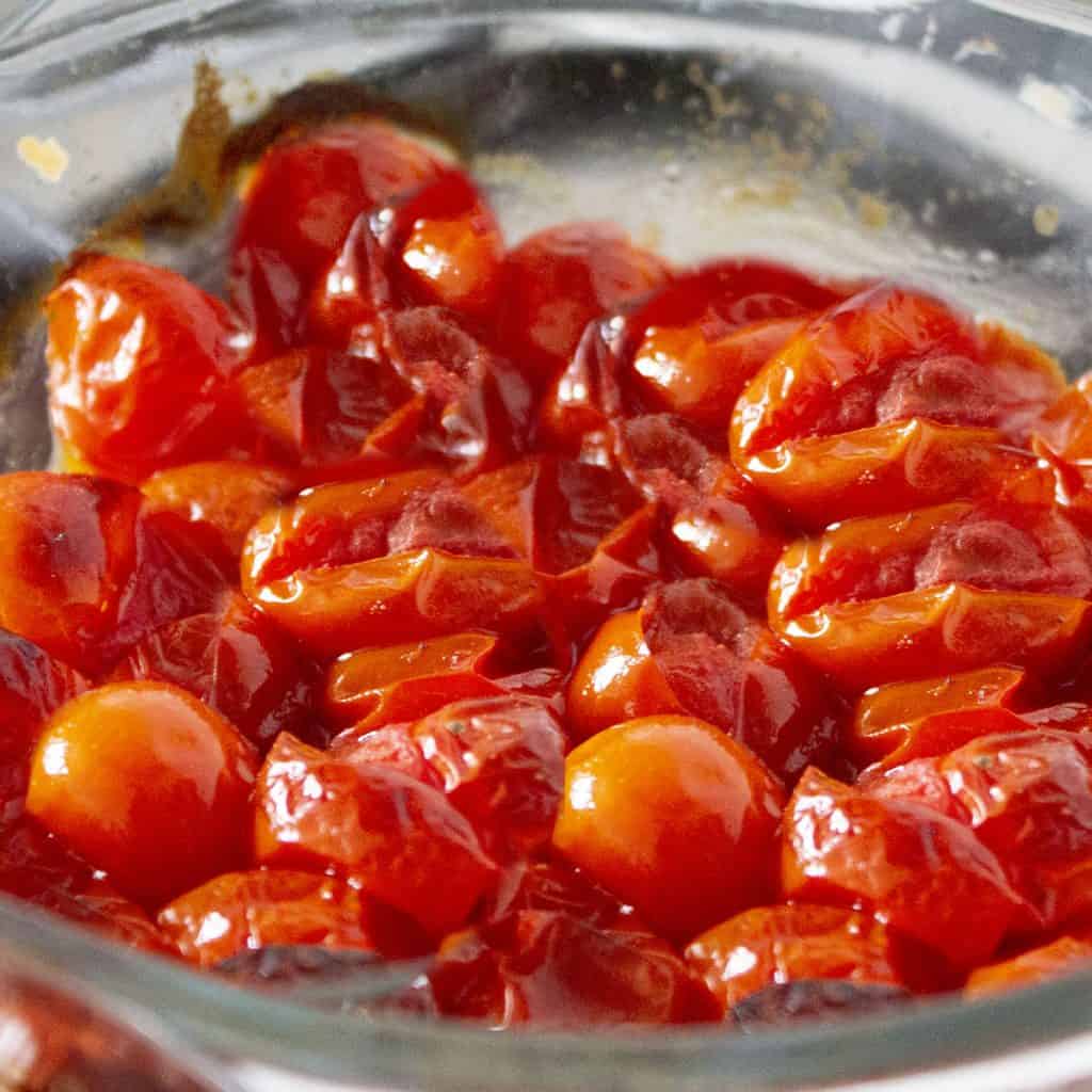 cooked cherry tomatoes in a bowl