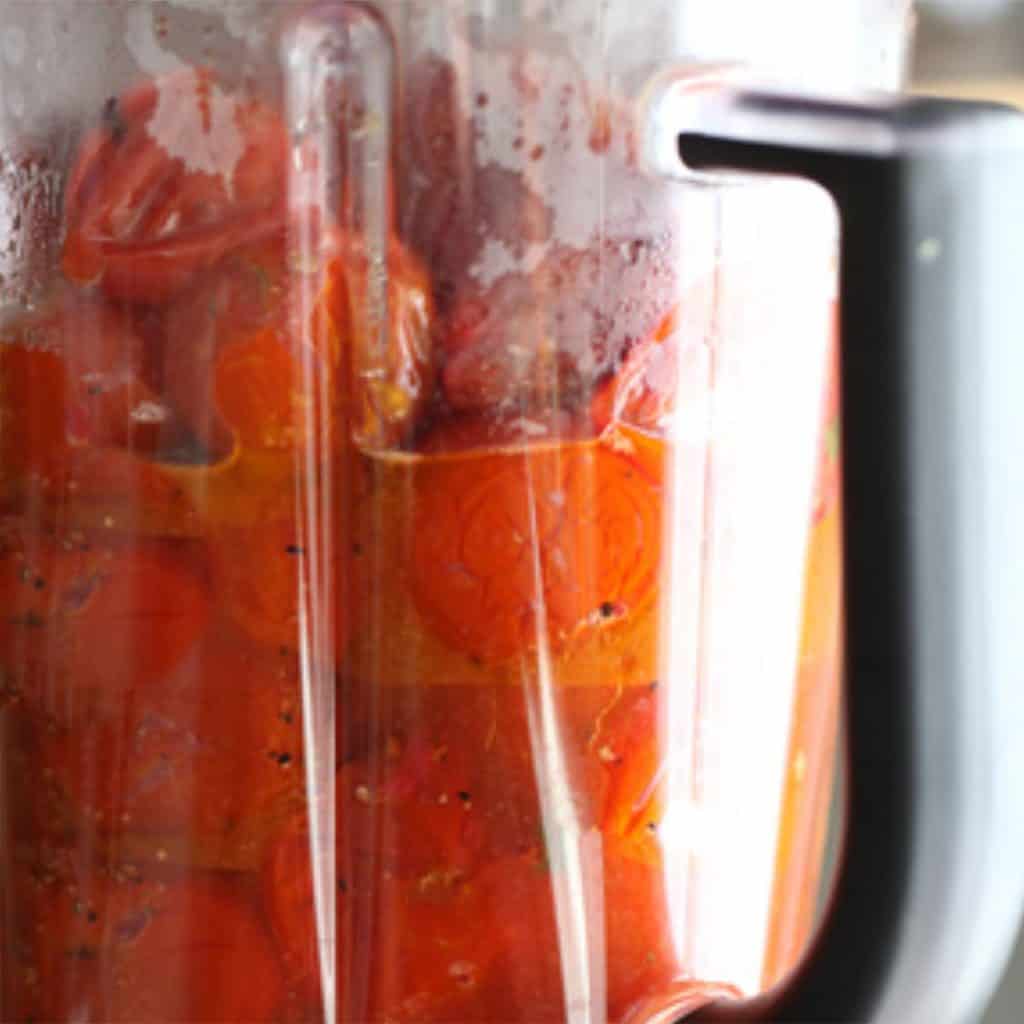 cherry tomatoes added to a blender