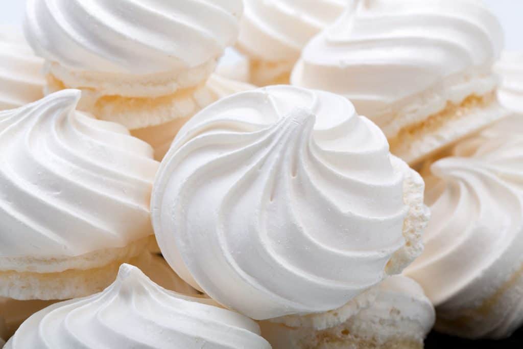 a big pile of meringue cookies