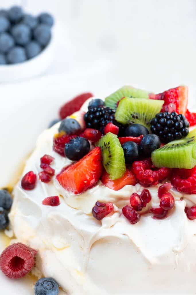 Pavlova with strawberries, blueberries, raspberries and passionfruit