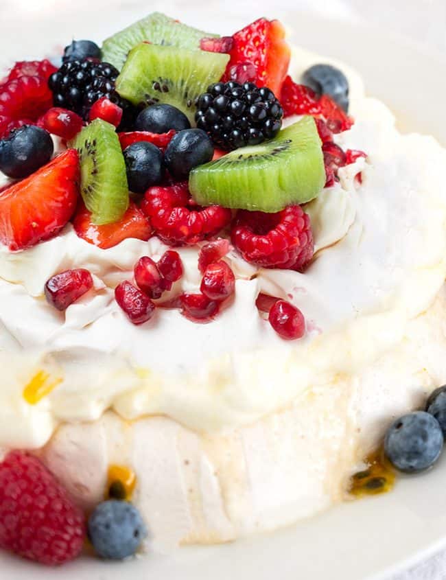 Pavlova with strawberries, blueberries, raspberries and passionfruit