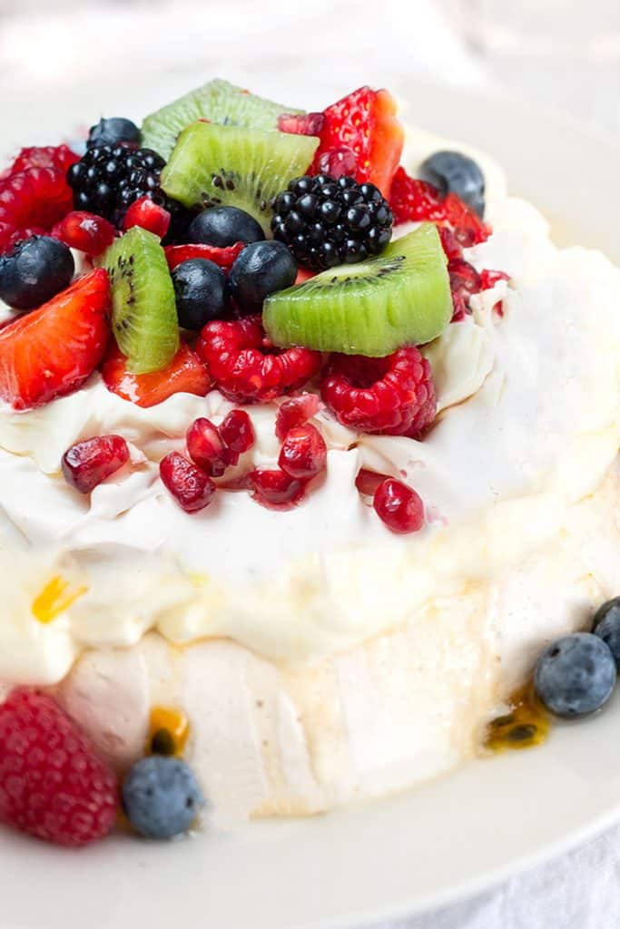 Pavlova with strawberries, blueberries, raspberries and passionfruit