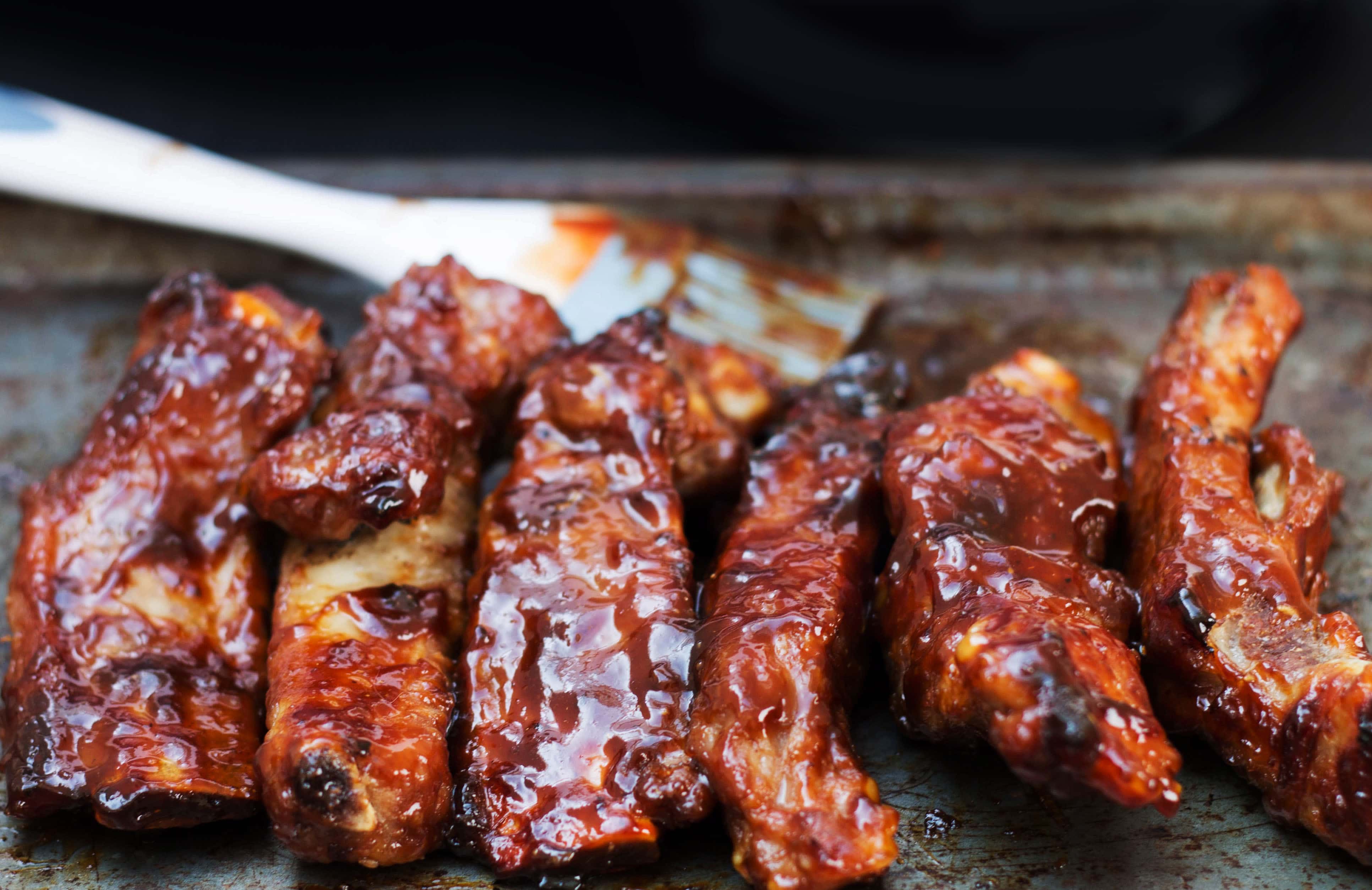 A close up of barbecued sticky glazed ribs