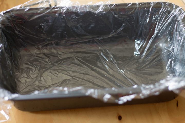 loaf tin covered with cling film pushed into it to cover 