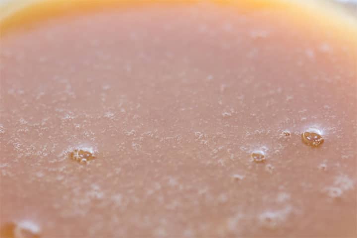 a close up of the golden sticky bun topping