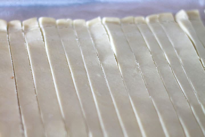 The puff pastry cut into strips