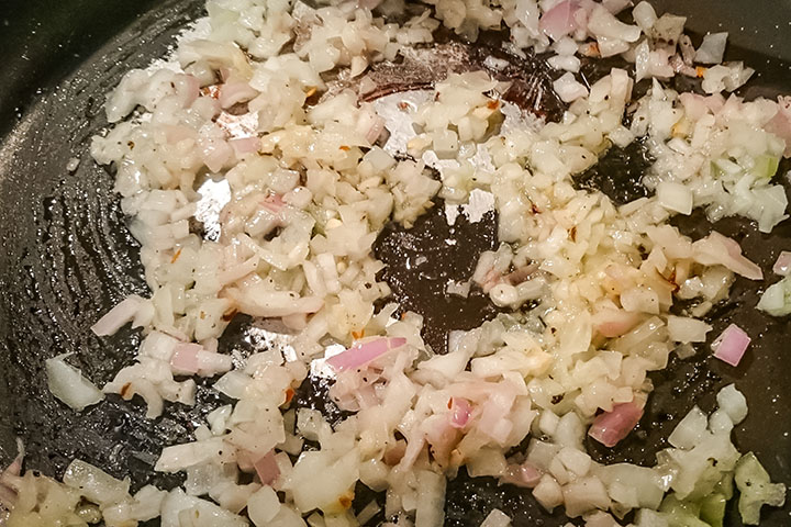 Shallots cooking in the pan in olive oil