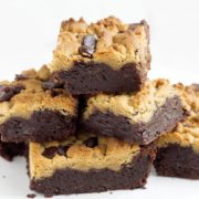 peanut butter chocolate fudge brownies piled on top of each other