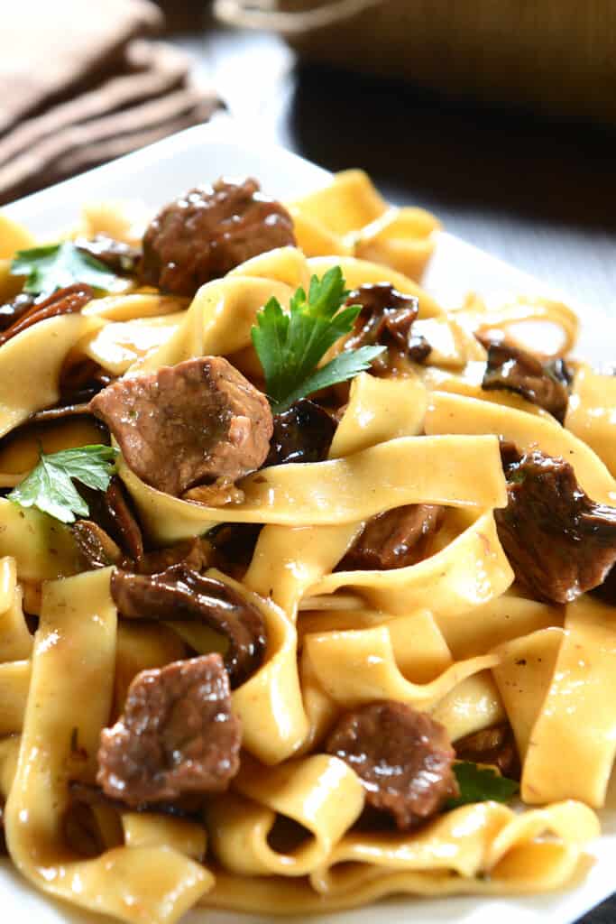 pasta with beef and mushrooms on a plate