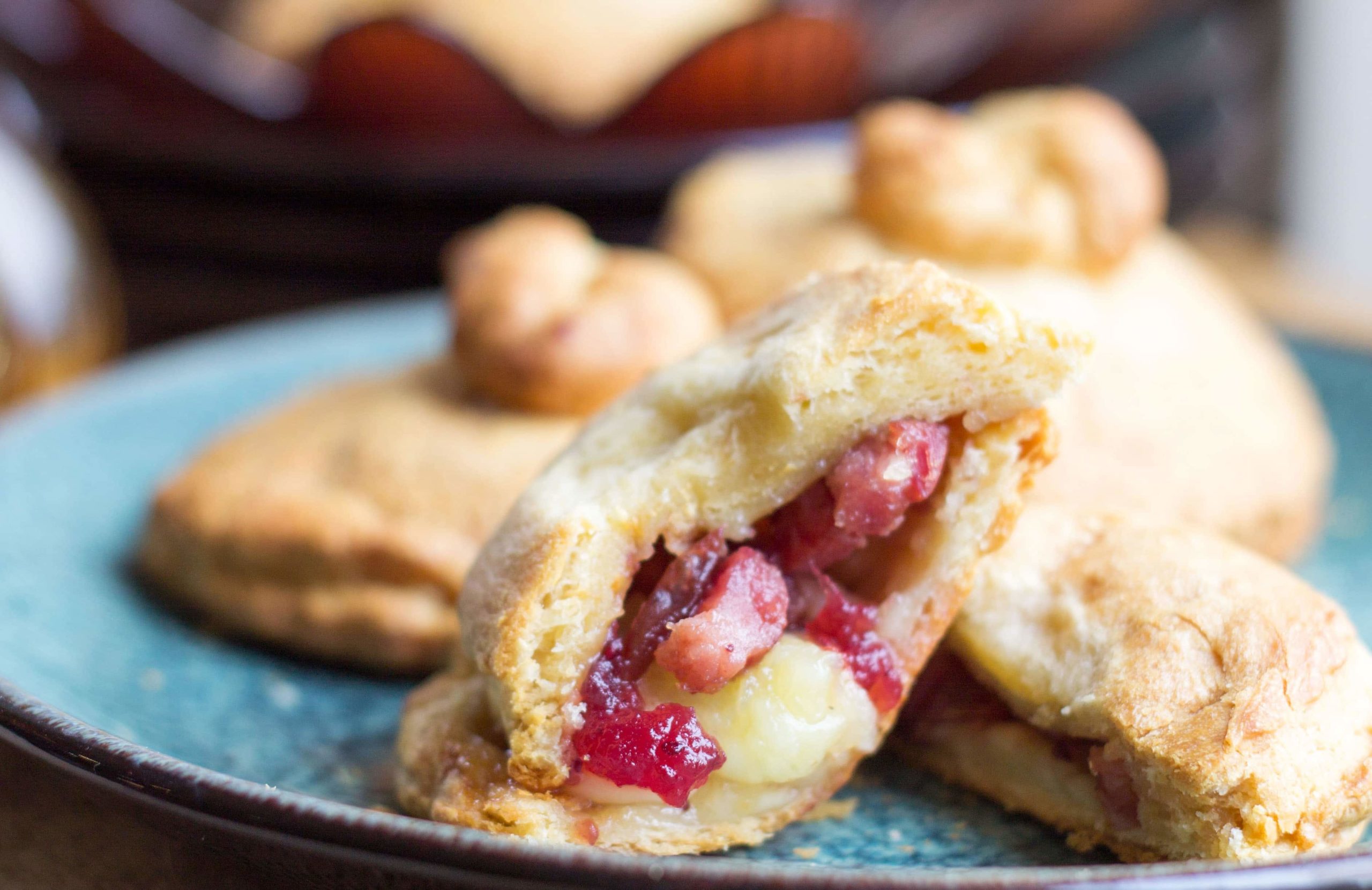 A close up of bacon cranberry and brie stuffed rolls