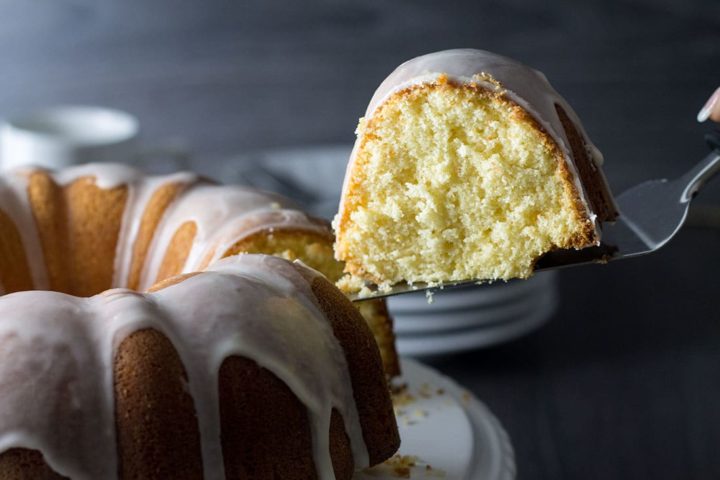 Citrus and Olive Oil Bundt Cake being served with a cake slice