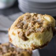 A close up of a cinnamon crumb bun