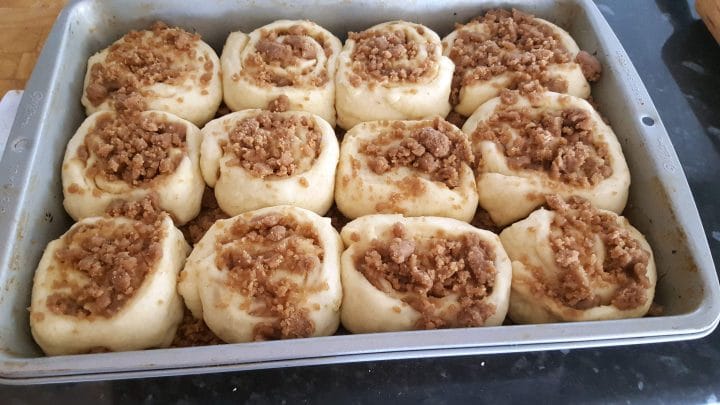 raw Cinnamon Crumb Buns in the pan after rising ready to bake