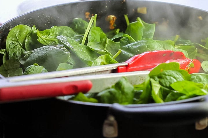 The spinach added to the Quick and Easy Sag Bahji {Spinach Curry}