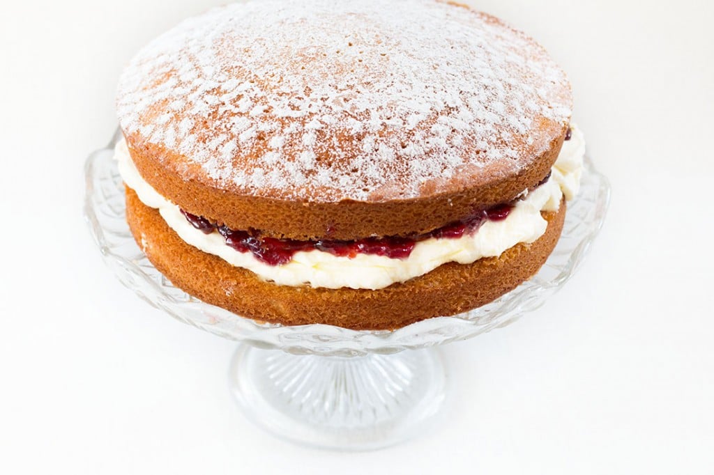 Classic Victoria Sponge Cake - Erren's Kitchen - This recipe uses the classic ingredients of vanilla sponge cake, fresh whipped cream and raspberry jam. Whether you're serving it for a special occasion or just to satisfy a craving, You can't go wrong with this perfect cake.