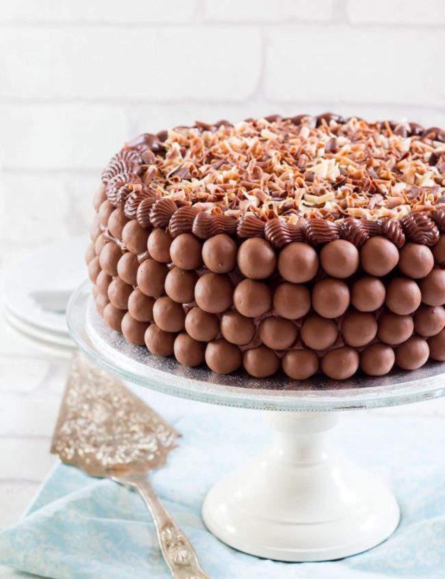 Chocolate Lovers Dream Cake - Erren's Kitchen - Indulge yourself with this amazing recipe. This heavenly moist, fudgy chocolate cake is filled with dark chocolate pudding, covered with chocolate butter cream, a layer of malted milk chocolate balls and topped with a layer of chocolate curls. Its any chocolate lover's dream cake.