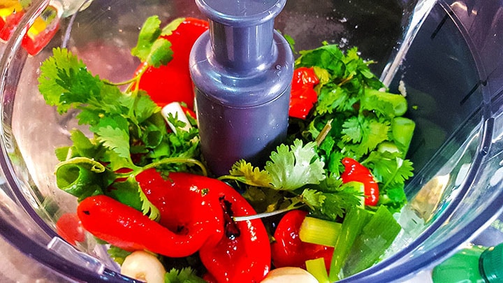 all of the ingredients for the thai red curry in a food processor