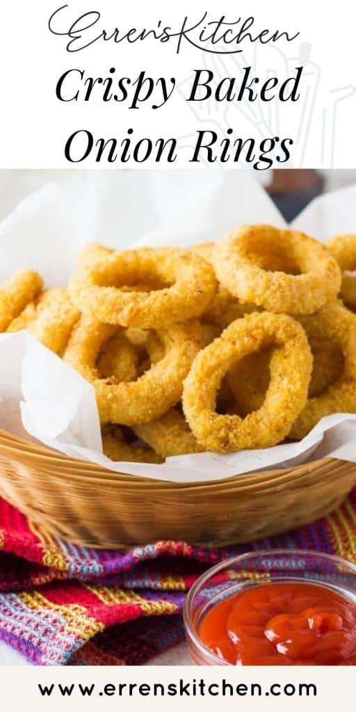onion rings in a basket with a side of tomato sauce