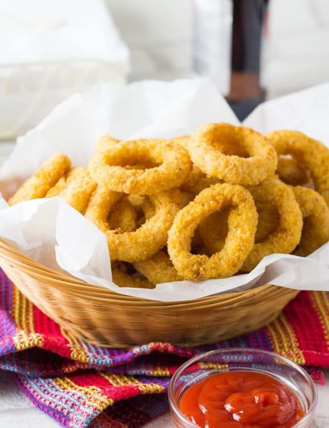 This recipe for Skinny Seasoned Baked Onion Rings from Erren's Kitchen makes a simple side dish of homemade and low fat onion rings that's so much healthier than fried - this version has a spiced breadcrumb coating that will make it a new family favorite.