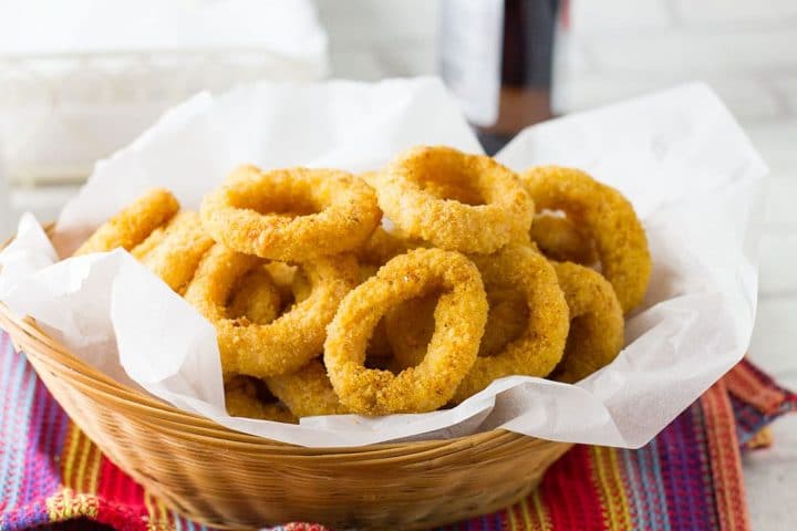 a big basket of golden brown baked, breaded onion rings