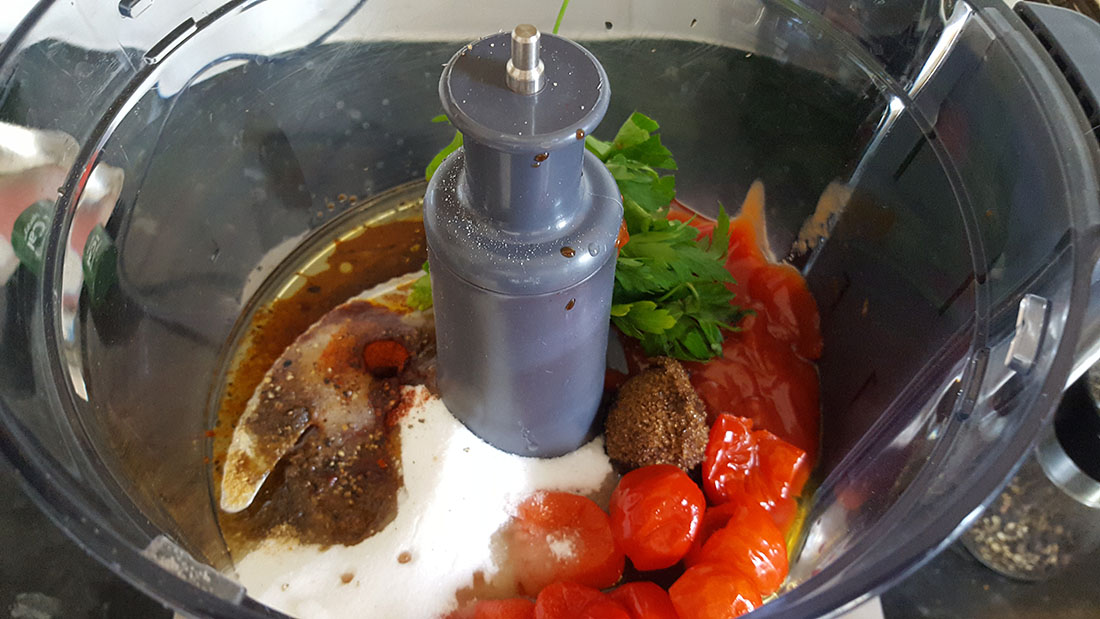 A blender filled with peppadew salad dressing ingredients