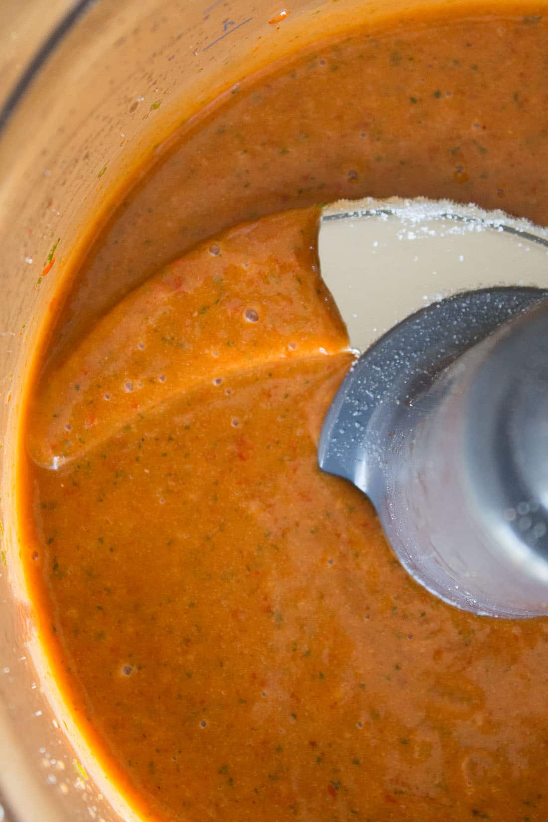A close up of a mixer filled with Catalina style peppadew dressing