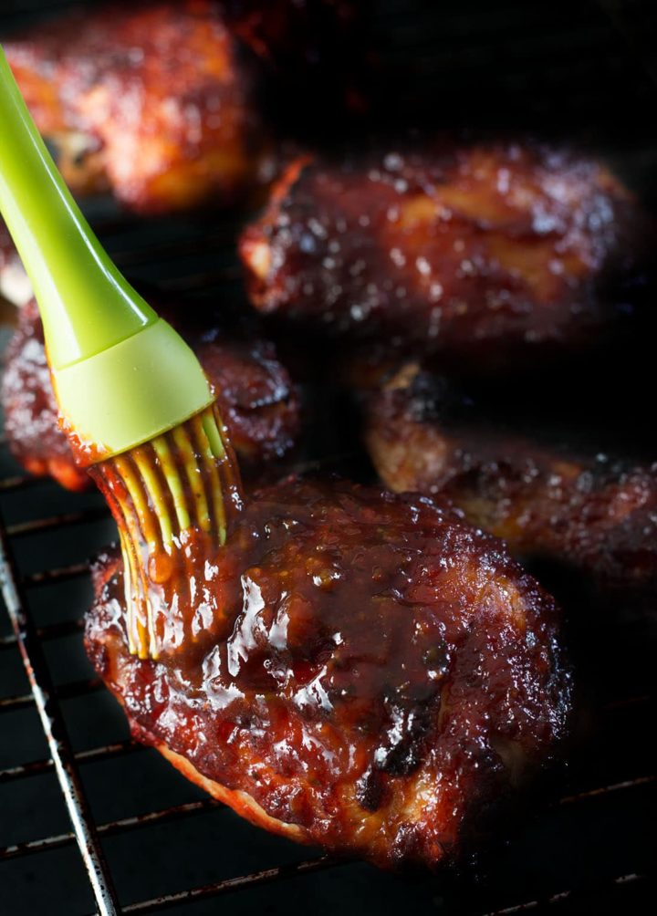Roasted Red Pepper barbecue sauce being brushed over chicken