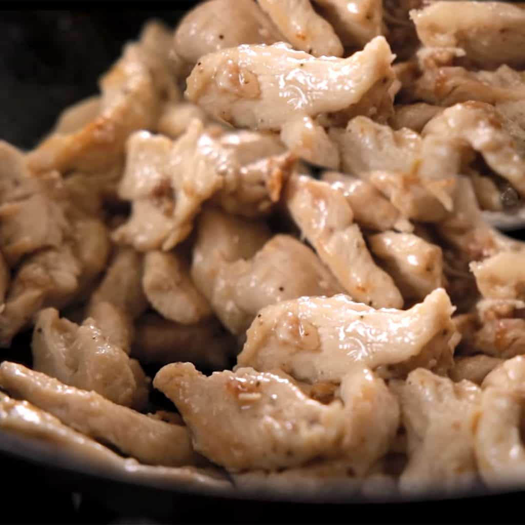 chicken cooking in a wok