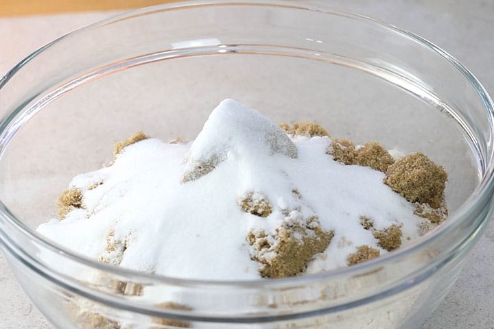 The sugars added to the bowl with the dried ingredients.