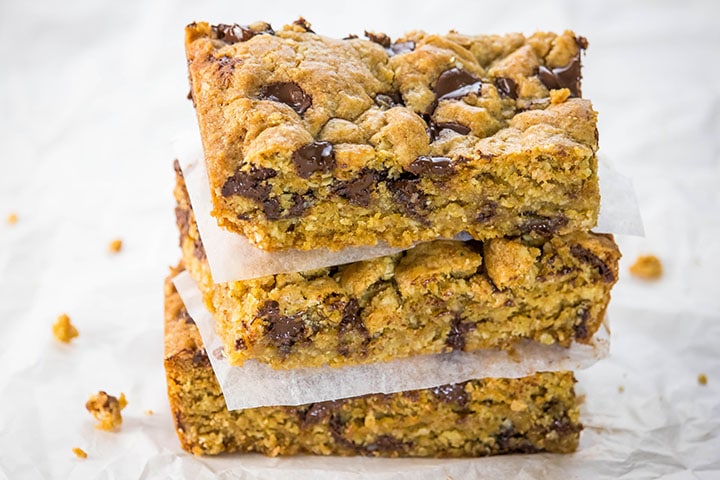 Three Chocolate Chip Oatmeal Cookie Bars stacked on top of each other.