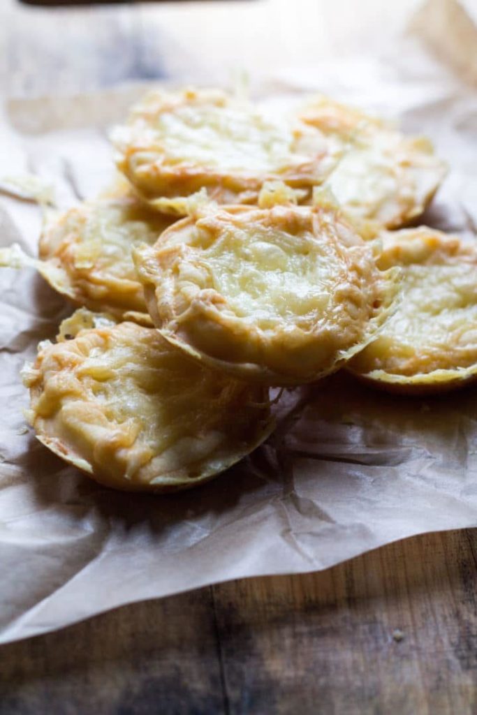 A board with Easy Cheesy Party Snackson top of baking paper.