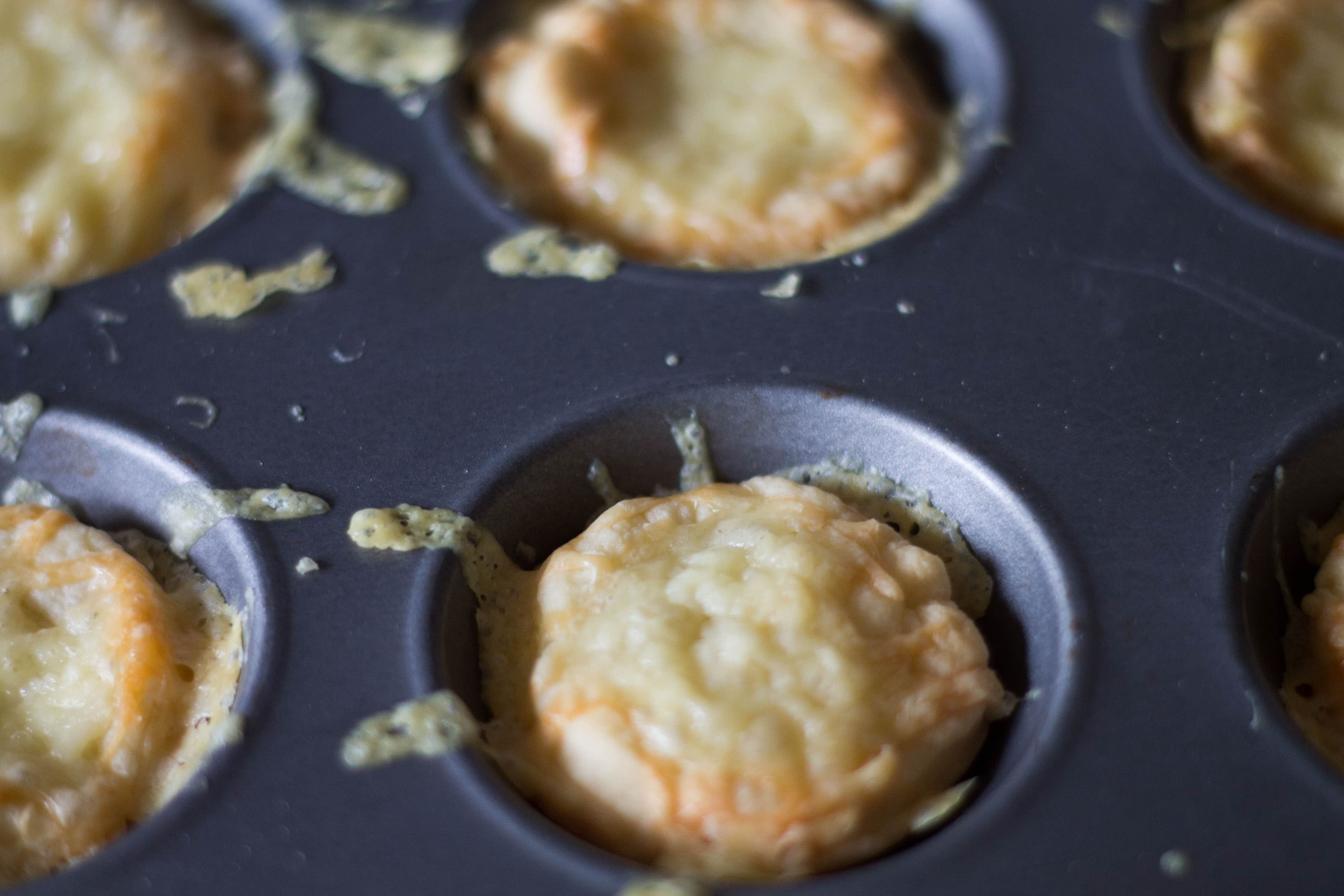 the baked cheese snacks still in the pan