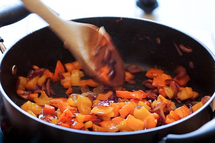 The onion, pepper and carrot cooked down