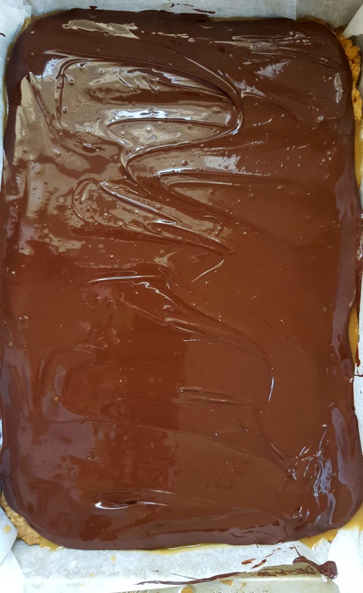 the melted chocolate smoothed over the caramel layer.