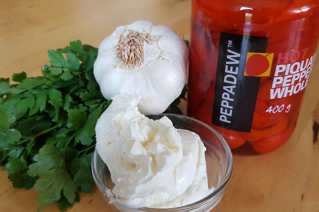 Cream cheese garlic parsley next to a jar of Peppadew Peppers