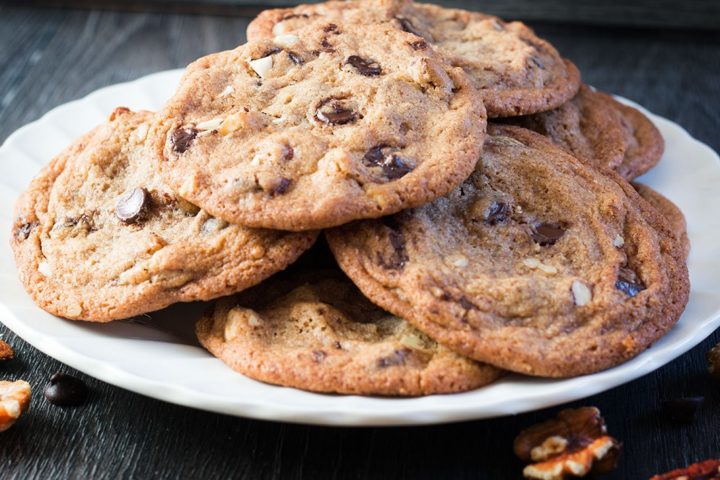 Nutty Chocolate Chip Cookies piled on a plate