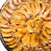 A close up of a warm apple cake topped with baked apples