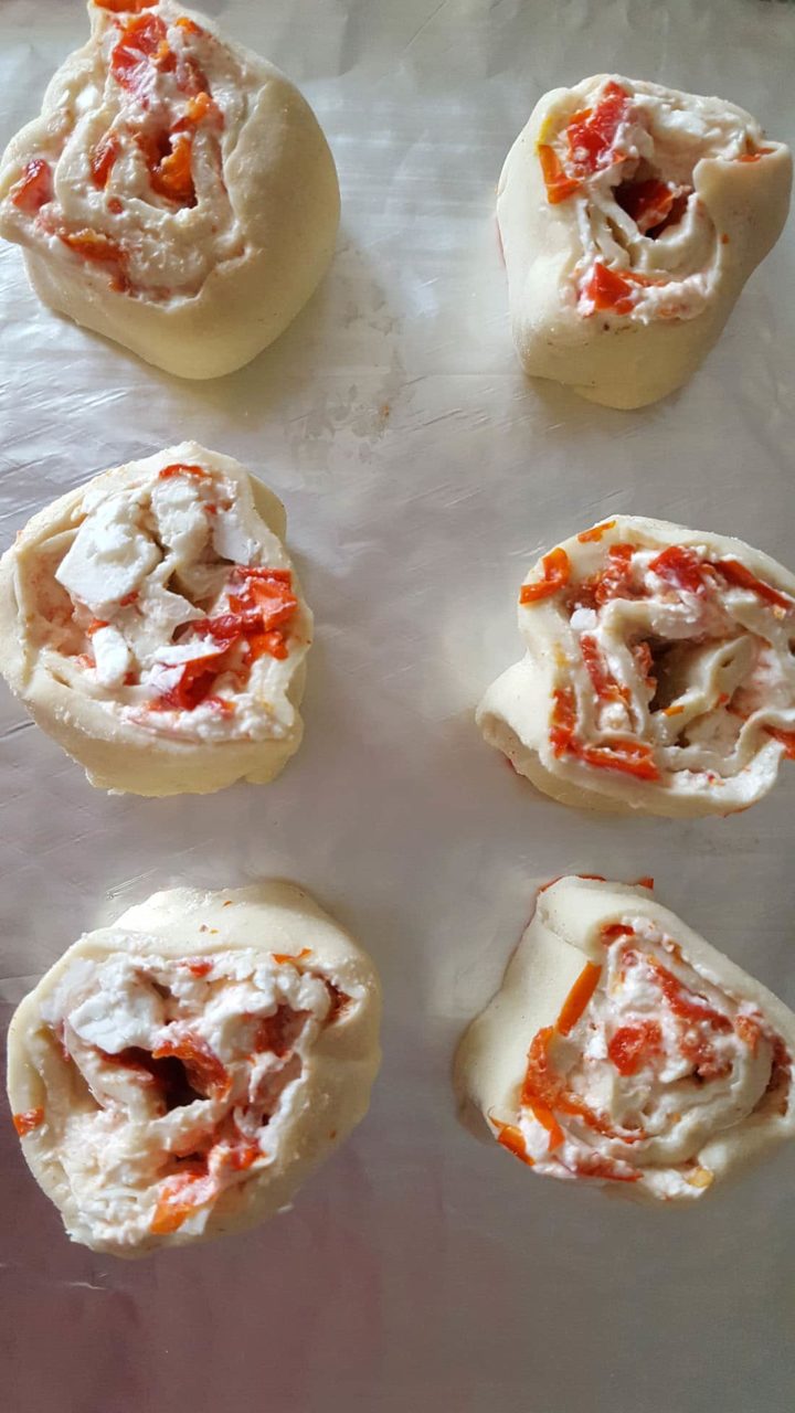 two rows of three Cream Cheese and red pepper swirls ready to go in the oven