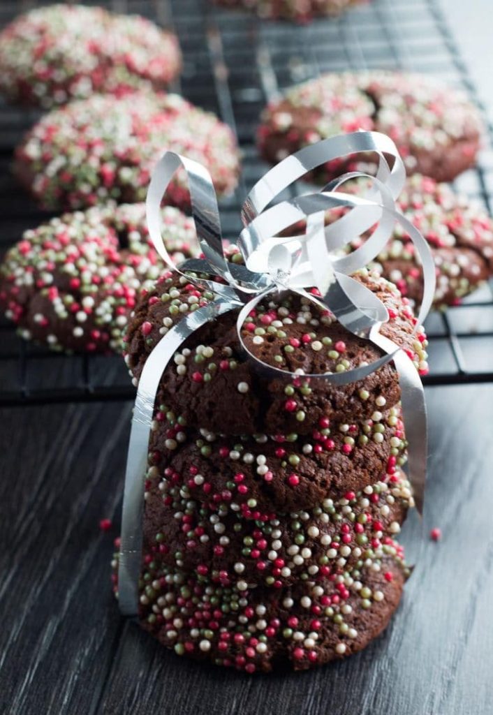 chocolate cookies tied with ribbon and decorated with sugar sprinkles